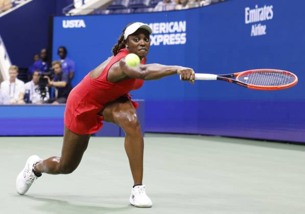 Sloane Stephens reaches to return a ball to Clara.Burel of France in Arthur Ashe Stadium in the first round of the 2024 US Open Tennis Championships in at the USTA Billie Jean King National Tennis Center on Monday, August 26, 2024 in New York City.  NYP20240826120 JOHNxANGELILLO