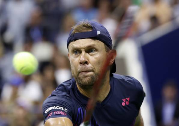 Radu Albot of Moldova returns a ball to Novak Djokovic of Serbia in Arthur Ashe Stadium in the first round of the 2024 US Open Tennis Championships in at the USTA Billie Jean King National Tennis Center on Monday, August 26, 2024 in New York City.  NYP20240826126 JOHNxANGELILLO