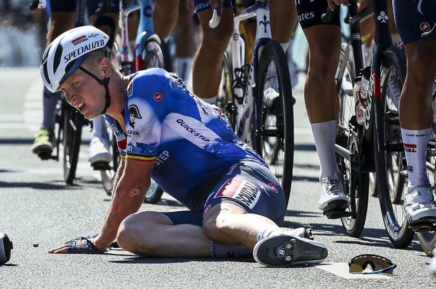 Belgian Tim Merlier of Soudal Quick-Step sits on the ground after crashing during the sprint of the first stage of the Renewi Tour multi-stage cycling race, from Riemst to Bilzen (163,6 km) on Wednesday 28 August 2024. The five-day race takes place in Belgium and the Netherlands. DAVIDxPINTENS x99251558x