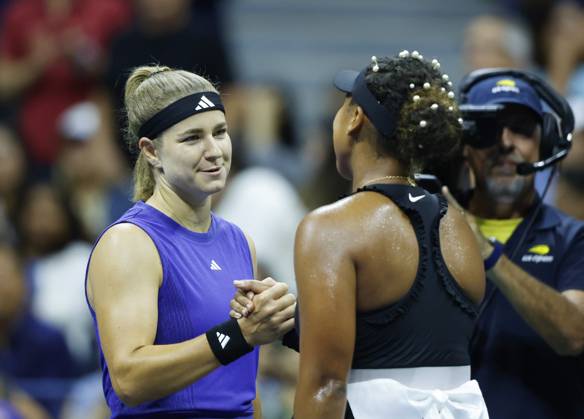 Karolina Muchova shakes hands with Naomi Osaka at net after defeating Osaka in straight sets in the second round in Arthur Ashe Stadium of the 2024 US Open Tennis Championships in at the USTA Billie Jean King National Tennis Center on Thursday, August 29, 2024 in New York City.  NYP20240829116 JOHNxANGELILLO