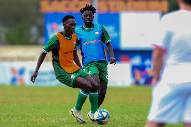 RECORD DATE NOT STATED NAMBOOLE, UGANDA - SEPTEMBER 01: Kenya Men˜s senior national team, Nationalteam midfielder Duke Abuya (left) shields teammate Austin Odhiambo in preparations for 2025 AfCON Qualifiers match against Zimbabwe at Stade Mandela National Stadium on September 1, 2024 in Uganda, Photo by Chris Omollo Copyright: xx