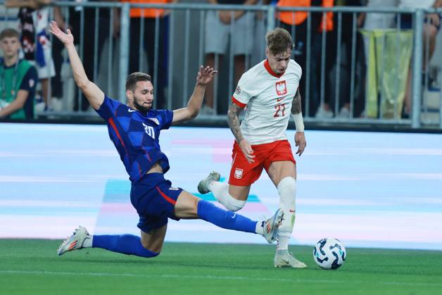 Croatia v Poland - UEFA Nations League 2024 25 League A Group A1 OSIJEK, CROATIA - SEPTEMBER 8: Player of Croatia Marko Pjaca stops player of Poland Nicola Zalewski during the UEFA Nations League 2024 25 League A Group A1 match between Croatia and Poland at on September 8, 2024 in Osijek, Croatia. DavorxJavorovicj Pixsell