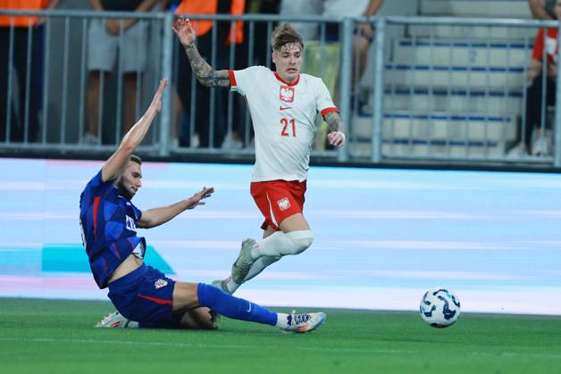 Croatia v Poland - UEFA Nations League 2024 25 League A Group A1 OSIJEK, CROATIA - SEPTEMBER 8: Player of Croatia Marko Pjaca stops player of Poland Nicola Zalewski during the UEFA Nations League 2024 25 League A Group A1 match between Croatia and Poland at on September 8, 2024 in Osijek, Croatia. DavorxJavorovicj Pixsell