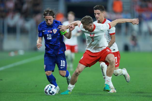 Croatia v Poland - UEFA Nations League 2024 25 League A Group A1 OSIJEK, CROATIA - SEPTEMBER 8: Player of Croatia Luka Modric and player of Poland Pawel Dawidowicz fight for a ball during the UEFA Nations League 2024 25 League A Group A1 match between Croatia and Poland at on September 8, 2024 in Osijek, Croatia. DavorxJavorovic Pixsell