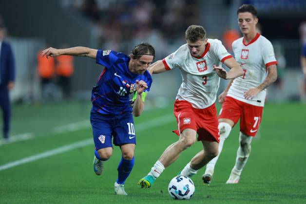 Croatia v Poland - UEFA Nations League 2024 25 League A Group A1 OSIJEK, CROATIA - SEPTEMBER 8: Player of Croatia Luka Modric and player of Poland Pawel Dawidowicz fight for a ball during the UEFA Nations League 2024 25 League A Group A1 match between Croatia and Poland at on September 8, 2024 in Osijek, Croatia. DavorxJavorovic Pixsell