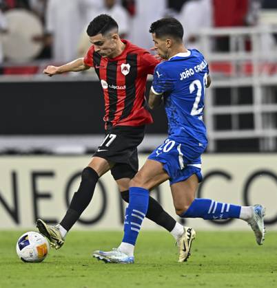 AFC CHAMPIONS LEAGUE ELITE, AL RAYYAN FC V AL-HILAL SFC Achraf Benchark (L) of Al Rayyan SC and Joao Cancelo of Al-Hilal SFC in action during the AFC Champions League elite west football match between Qatar s Al Rayyan SC and Saudi Arabia s Al-Hilal SFC at Ahmad Bin Ali Stadium in Al Rayyan, Qatar on September 17, 2024. DOHA Qatar Copyright: xNOUSHADx