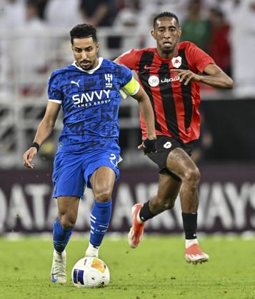 AFC CHAMPIONS LEAGUE ELITE, AL RAYYAN FC V AL-HILAL SFC Joshua Brenet (R) of Al Rayyan SC and Salem Al Dawsari of Al-Hilal SFC in action during the AFC Champions League elite west football match between Qatar s Al Rayyan SC and Saudi Arabia s Al-Hilal SFC at Ahmad Bin Ali Stadium in Al Rayyan, Qatar on September 17, 2024. DOHA Qatar Copyright: xNOUSHADx