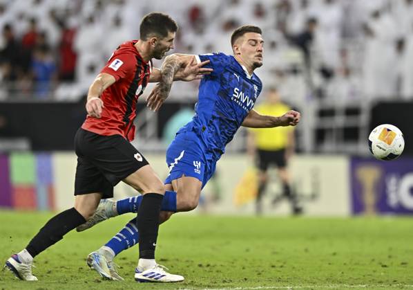 AFC CHAMPIONS LEAGUE ELITE, AL RAYYAN FC V AL-HILAL SFC David Garcia (L) of Al Rayyan SC and Sergej of Al-Hilal SFC in action during the AFC Champions League elite west football match between Qatar s Al Rayyan SC and Saudi Arabia s Al-Hilal SFC at Ahmad Bin Ali Stadium in Al Rayyan, Qatar on September 17, 2024. DOHA Qatar Copyright: xNOUSHADx