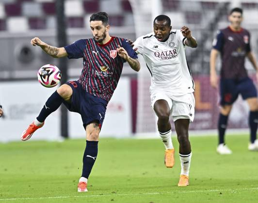 AL-SADD SC VS AL DUHAIL SC-OOREDOO STARS LEAGUE QATAR Mohamed Camara (R) of Al-Sadd SC and Luis Alberto (L) of Al Duhail SC in action during the Ooredoo Qatar Stars League 24 25 match between Al-Sadd SC and Al Duhail SC at Jassim bin Hamad Stadium in Doha, Qatar, on September 21, 2024. DOHA Qatar Copyright: xNOUSHADx