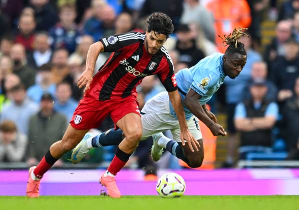 Manchester City v Fulham Premier League Raul Jimenez of Fulham and Jeremy Doku of Manchester City during the Premier League match at the Etihad Stadium, Manchester UK Newspapers OUT Copyright: xKarlxVallantinex FIL-20724-0044