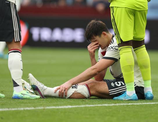 Football - 2024 2025 Premier League - Aston Villa vs Manchester United, ManU - Villa Park - Sunday 6th October 2024 Harry Maguire of Manchester United lies injured and looks dejected