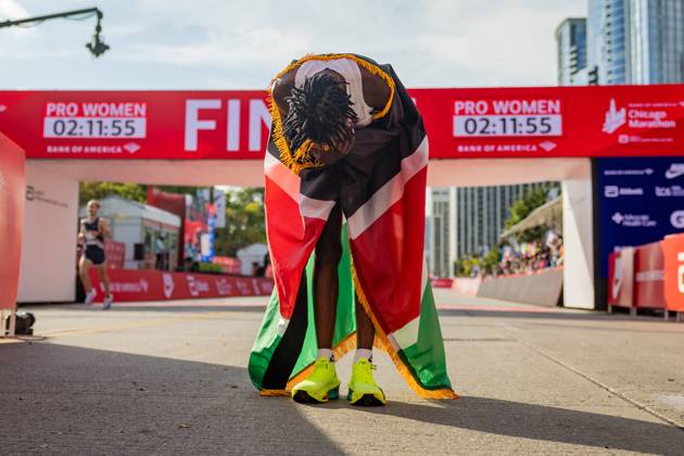 October 13, 2024, Chicago, IL, USA: Ruth Chepngetich, from Kenya, lowers her head while wearing the Kenyan flag after crossing the finish line of the Chicago Marathon to win the womenÃ¢â‚¬â ¢s professional division and break the womenÃ¢â‚¬â ¢s marathon world record in Grant Park on Oct. 13, 2024, in Chicago. Chicago USA - ZUMAm67_ 0770068775st Copyright: xTessxCrowleyx