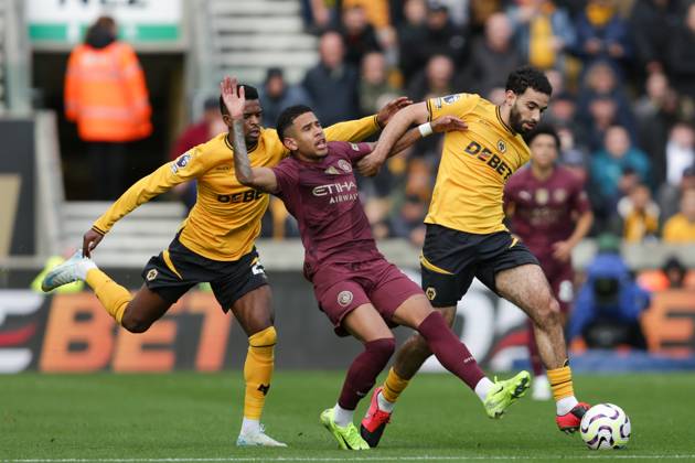 Wolverhampton Wanderers FC v Manchester City FC - Premier League Savinho of Manchester City is in action with Nelson Semedo and Rayan Ait-Nouri of Wolves during the Premier League match between Wolverhampton Wanderers and Manchester City at Molineux in Wolverhampton, England, on October 20, 2024. Wolverhampton West Midlands United Kingdom Copyright: xMIxNewsx originalFilename:fletcher-wolverha240820_npXh0