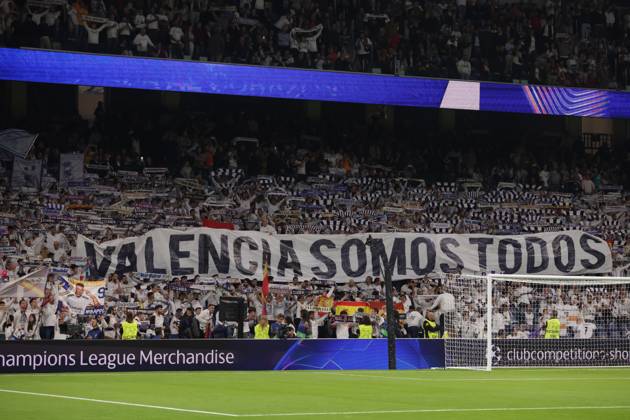 Madrid, Spain, 5th November 2024. Real Madrid fans unveil a banner bearing the Phrase We are all Valencia prior to kick off in the UEFA Champions League match at the Santiago Bernabau, Madrid. Picture credit should read: Jonathan Moscrop Sportimage EDITORIAL USE ONLY. No use with unauthorised audio, video, data, fixture lists, club league logos or live services. Online in-match use limited to 120 images, no video emulation. No use in betting, games or single club league player publications. SPI-3425-0073