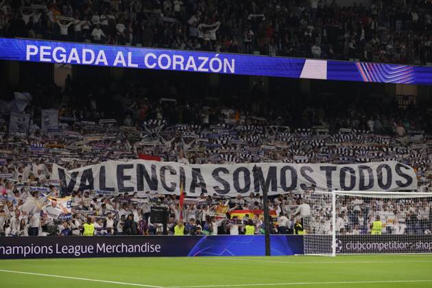 Madrid, Spain, 5th November 2024. Real Madrid fans unveil a banner bearing the Phrase We are all Valencia prior to kick off in the UEFA Champions League match at the Santiago Bernabau, Madrid. Picture credit should read: Jonathan Moscrop Sportimage EDITORIAL USE ONLY. No use with unauthorised audio, video, data, fixture lists, club league logos or live services. Online in-match use limited to 120 images, no video emulation. No use in betting, games or single club league player publications. SPI-3425-0074
