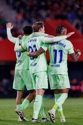 December 3, 2024, Palma De Mallorca, Spain: Frenkie De Jong, Raphinha, Pedri FC Barcelona, Barca celebrate after scoring a goal during the LaLiga EA SPORTS game between RCD Mallorca and FC Barcelona at Estadi Mallorca Son Moix. Final scores RCD Mallorca 1-5 FC Barcelona. Palma De Mallorca Spain - ZUMAs197 20241203_aaa_s197_431 Copyright: xMaciejxRogowskix