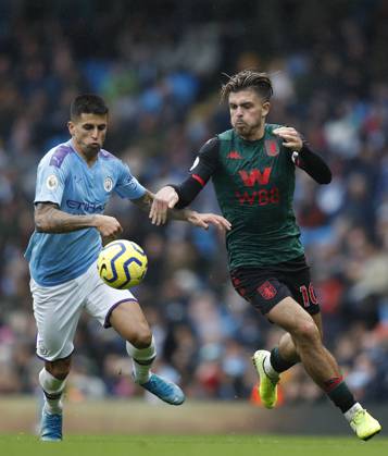 Manchester City v Aston Villa - Premier League - Etihad Stadium October 26, 2019, Manchester, United Kingdom: Joao Cancelo of Manchester City challenges Jack Grealish of Aston Villa during the Premier League match at the Etihad Stadium, Manchester. Picture date: 26th October 2019. Picture credit should read: Darren Staples Sportimage Manchester United Kingdom EDITORIAL USE ONLY Copyright: xx ZUMA-20191026_zaf_si1_041.jpg DarrenxStaplesx csmphototwo600936