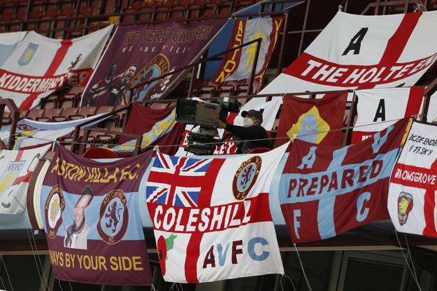 Aston Villa v Manchester United, ManU - Premier League - Villa Park July 9, 2020, Birmingham, United Kingdom: A TV cameraman amongst the flags during the Premier League match at Villa Park, Birmingham. Picture date: 9th July 2020. Picture credit should read: Darren Staples Sportimage Birmingham United Kingdom EDITORIAL USE ONLY Copyright: xx ZUMA-20200709_zaf_si1_095.jpg DarrenxStaplesx csmphototwo676960