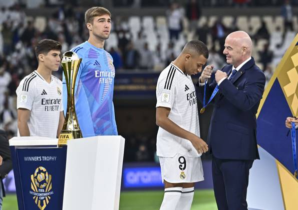 (241219) -- LUSAIL, Dec. 19, 2024 -- FIFA President Gianni Infantino (1st R) awards Kylian Mbappe (2nd R) of Real Madrid with the gold medal during the podium ceremony after the FIFA Intercontinental Cup Qatar 2024 Final match between Spain s Real Madrid and Mexico s CF Pachuca at Lusail Stadium in Lusail, Qatar, on Dec. 18, 2024. (Photo by Xinhua) (SP)QATAR-LUSAIL-FIFA INTERCONTINENTAL CUP-FINAL-REAL MADRID VS PACHUACA Nikku