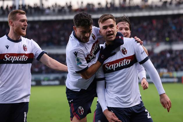 Turin, Italy, 21st December 2024. Thijs Dallinga of Bologna FC celebrates with team mates Tommaso Pobega, Riccardo Orsolini and Juan Miranda after scoring to give the side a 1-0 lead during the Serie A match at Stadio Grande Torino, Turin. Picture credit should read: Jonathan Moscrop Sportimage EDITORIAL USE ONLY. No use with unauthorised audio, video, data, fixture lists, club league logos or live services. Online in-match use limited to 120 images, no video emulation. No use in betting, games or single club league player publications. SPI-3533-0021