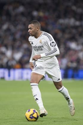 LA LIGA EA Sports - Real Madrid vs Sevilla MADRID, SPAIN - December 22: Kylian Mbappe of Real Madrid in action during the La Liga 2024 25 match between Real Madrid and Sevilla at Santiago Bernabeu Stadium. (Photo by Guillermo Martinez) Madrid Santiago BernabÃ u Stadium Spain Copyright: xGuillermoxMartinezx
