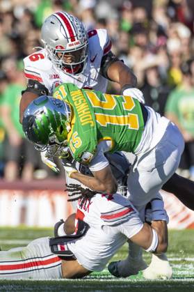 January 1, 2025, Los Angeles, California, United States: Oregon wide receiver Tez Johnson 15 is brought down by Ohio State cornerback Jordan Hancock 7 and linebacker Sonny Styles 6 during the 2025 Rose Bowl game Wednesday, Jan. 1, 2024, in Pasadena, Calif. Los Angeles USA - ZUMAc68_ 20250101_zaf_c68_017 Copyright: xRingoxChiux