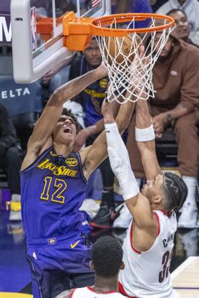 January 2, 2025, Los Angeles, California, United States: Los Angeles Lakers Max Christie 12 shoots under pressure from Portland Trail Blazers Toumani Camara 33 during an NBA, Basketball Herren, USA basketball game at Crypto.com Arena. Final score; Lakers 114:106 Trail Blazers Los Angeles United States - ZUMAs197 20250102_aaa_s197_174 Copyright: xRingoxChiux