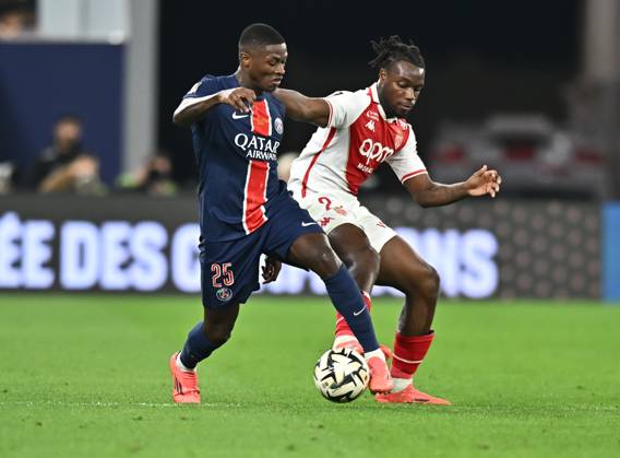 French Super Cup (Trophee des Champions) - Paris Saint-Germain vs AS Monaco Nuno Mendes (L) of Paris Saint-Germain and George Ilenikhena of AS Monacoin action during the French Super Cup (Trophee des Champions) football final match between Paris Saint-Germain (PSG) and AS Monaco at the 974 stadium in Doha, Qatar on January 5, 2025. DOHA Qatar Copyright: xNOUSHADx