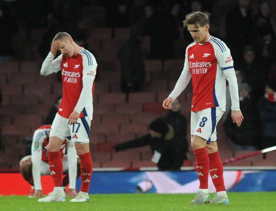 Football - 2024 2025 EFL Carabao League Cup - Semi-Final - First Leg - Arsenal vs Newcastle United - Emirates Stadium - Tuesday 7th January 2025 Dejected Arsenal players, Martin Odegaard and Oleksandr Zinchenko at the final whistle after losing 2-0