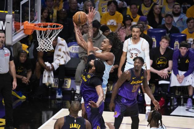 January 13, 2025, Los Angeles, California, United States: San Antonio Spurs Devin Vassell (R) goes to the basket under pressure from Los Angeles Lakers Anthony Davis (L) during an NBA, Basketball Herren, USA basketball game at Crypto.com Arena. Final score; Spurs 126:102 Lakers Los Angeles United States - ZUMAs197 20250113_aaa_s197_311 Copyright: xRingoxChiux