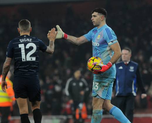 Football - 2024 2025 Premier League - Arsenal vs Aston Villa - Emirates Stadium - Saturday 18th January 2025 Ex Arsenal player Emiliano Martinez of Aston Villa celebrates after the match with Digne COLORSPORT Andrew Cowie