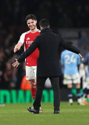 London, England, 2nd February 2025. Declan Rice of Arsenal celebrates with Mikel Arteta manager of Arsenal during the Premier League match at the Emirates Stadium, London. Picture credit should read: David Klein Sportimage EDITORIAL USE ONLY. No use with unauthorised audio, video, data, fixture lists, club league logos or live services. Online in-match use limited to 120 images, no video emulation. No use in betting, games or single club league player publications. SPI_054_DK_Arsenal_Man_City SPI-3653-0054