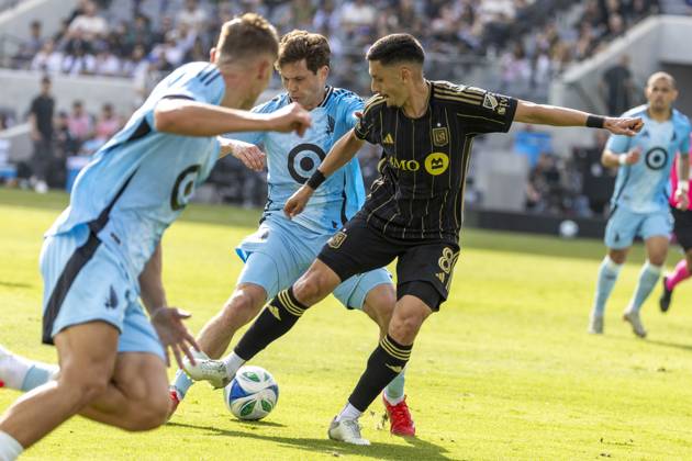 February 22, 2025, Los Angeles, California, United States: Los Angeles FC s Marky Delgado 8 and Minnesota United s Wil Trapp 20 vie for the ball during an MLS, Fussball Herren, USA soccer match at BMO Stadium. Final score; Los Angeles FC 1:0 Minnesota United FC Los Angeles United States - ZUMAs197 20250222_aaa_s197_318 Copyright: xRingoxChiux