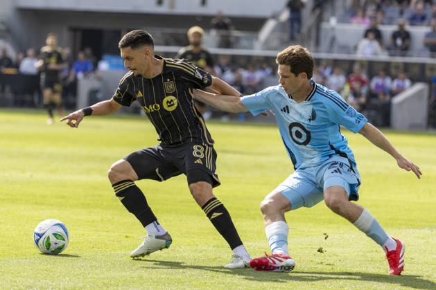February 22, 2025, Los Angeles, California, United States: Los Angeles FC s Marky Delgado 8 and Minnesota United s Wil Trapp 20 vie for the ball during an MLS, Fussball Herren, USA soccer match at BMO Stadium. Final score; Los Angeles FC 1:0 Minnesota United FC Los Angeles United States - ZUMAs197 20250222_aaa_s197_321 Copyright: xRingoxChiux