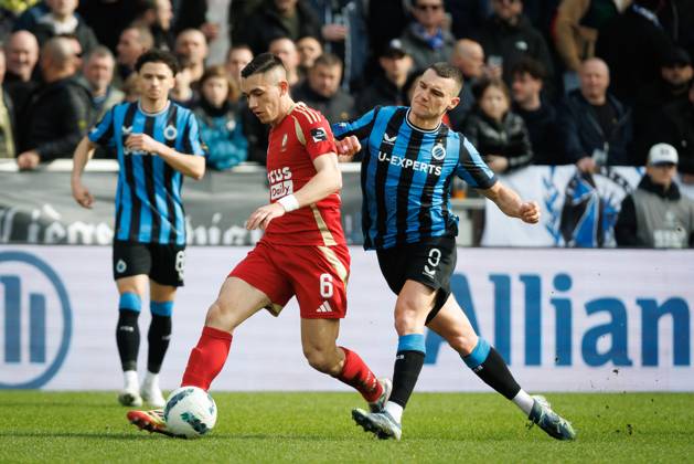Standard s Sotiris Alexandropoulos and Club s Ferran Jutgla fight for the ball during a soccer match between Club Brugge and Standard de Liege, Sunday 23 February 2025 in Brugge, on day 27 of the 2024-2025 season of the Jupiler Pro League first division of the Belgian championship. KURTxDESPLENTER x113088585x