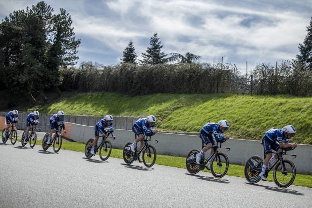Soudal Quick-Step riders pictured during the warming up ahead of stage three of the 83th edition of the Paris-Nice cycling race, a 28,4km team time trial at the Nevers Magny-Cours racetrack, in Nevers, France, Tuesday 11 March 2025. DAVIDxPINTENS  x114676914x