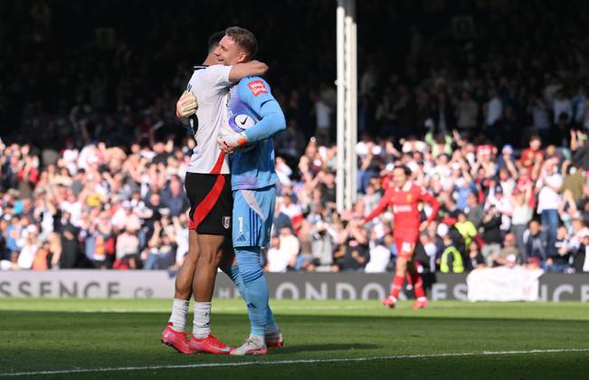 Football - 2024 2025 Premier League - Fulham vs Liverpool - Craven Cottage - Sunday 6th April 2025. Fulham s Bernd Leno with Antonee Robinson at the final whistle. COLORSPORT Ashley Western