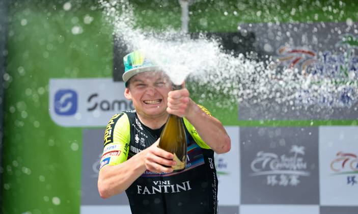 (250409) -- BAOTING, April 9, 2025 -- Kyrylo Tsarenko of Solution Tech Vini Fantini celebrates during the awarding ceremony after Stage 3 at the 16th Tour of Hainan cycling race from Lingshui to Baoting, south China s Hainan Province, April 9, 2025. ) (SP)CHINA-HAINAN-BAOTING-CYCLING-TOUR OF HAINAN (CN) YangxGuanyu 