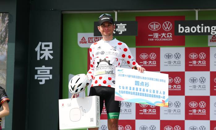 (250409) -- BAOTING, April 9, 2025 -- Nils Sinschek of Parkhotel Valkenburg celebrates in the polka-dot jersey during the awarding ceremony after Stage 3 at the 16th Tour of Hainan cycling race from Lingshui to Baoting, south China s Hainan Province, April 9, 2025. ) (SP)CHINA-HAINAN-BAOTING-CYCLING-TOUR OF HAINAN (CN) YangxGuanyu 