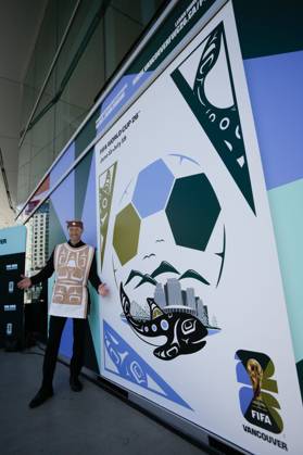 (250416) -- VANCOUVER, April 16, 2025 -- The designer for the 2026 FIFA World Cup, WM, Weltmeisterschaft, Fussball official host city, artist Jamin Zuroski, poses for photos at BC Place in Vancouver, British Columbia, Canada, April 15, 2025. Vancouver unveiled the official host city poster for the 2026 FIFA World Cup on Tuesday, showcasing the integration of local characteristics with the spirit of the tournament. The 2026 FIFA World Cup will be jointly hosted by Canada, Mexico and the United States. As one of Canada s host cities, Vancouver is set to stage seven matches during the event. (Photo by Xinhua) (SP)CANADA-VANCOUVER-FOOTBALL-FIFA WORLD CUP-POSTER LiangxSen