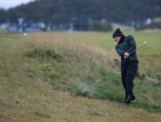 UK: The Alfred Dunhill Links Championship at Kingsbarns, St Andrews, Scotland on 30 September 2022 Pictured: Ex-footballer Gianfranco Zola plays out of rough on the 9th fairway at Kingsbarns during the second round of the Alfred Dunhill Links Championship 2022 St Andrews Fife Scotland Copyright: xAlexxToddx