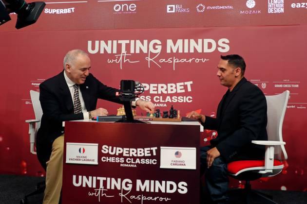 (250507) -- BUCHAREST, May 7, 2025 -- Former World Chess Champion Garry Kasparov (L) of Russia makes a move of an opening symbolic match against Constantin Bracon, a Romanian disabled person, during the official opening ceremony of the Grand Chess Tour 2025 tournament in Bucharest, Romania, May 6, 2025. (Photo by Xinhua) (SP)ROMANIA-BUCHAREST-GRAND CHESS TOUR 2025 CristianxCristel