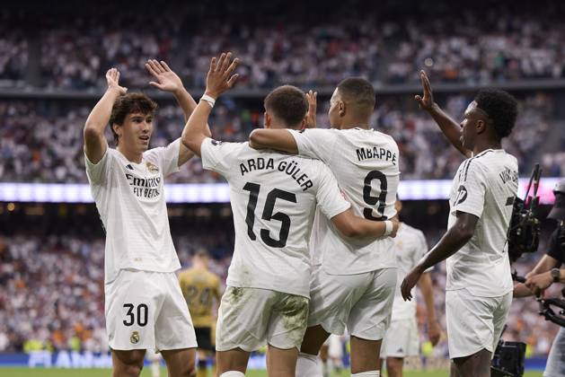 Kylian Mbappe Real Madrid CF celebrates after scoring his team˜s second goal with team mates during the LaLiga match between Real Madrid and Real Sociedad at Santiago Bernabà u on May 24, 2025 in Madrid, Spain Photo by Manu Reino DeFodi Images