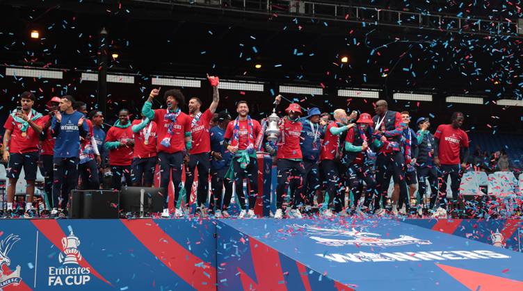. - Crystal Palace FA Cup Trophy Parade & Celebrations, Selhurst Park Stadium, London, England. - 26th May 2025. (C) Daniel Weir Crystal Pix Joel Ward of Crystal Palace & Marc Guehi of Crystal Palace hold aloft the Emirates FA Cup Trophy in celebration with there team mates on the stage at Selhurst Park under Confetti during the Crystal Palace FA Cup trophy bus parade & party celebrations at Selhurst Park stadium in South London. - Crystal Palace FA Cup Trophy Parade & Celebrations, Selhurst Park Stadium, London, England. - 26th May 2025. (C) Daniel Weir Crystal Pix London Selhurst Park Stadium United Kingdom Copyright: xDanielxWeirx CP_Crystal_Palace_Bus_Parade_Party_06