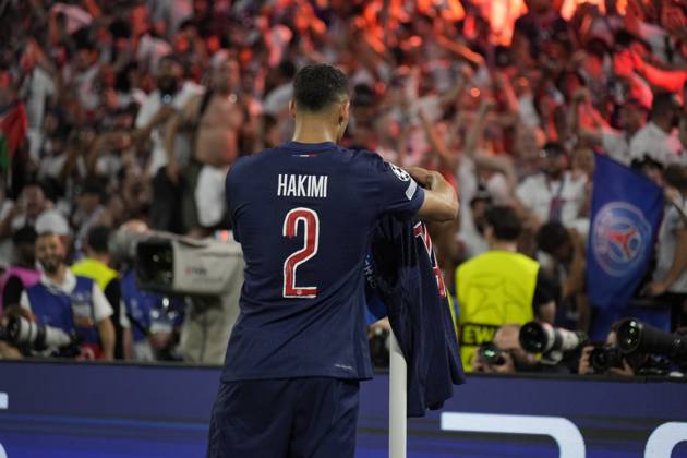 2025 UEFA Champions League Final: Paris Saint-Germain F.C. vs. FC Internazionale Milano Desire Doue of Paris Saint-Germain F.C. scores his second goal of the evening and celebrates, as his teammate Achraf Hakimi of Paris Saint-Germain F.C. puts his shirt on the corner flag during the 2025 UEFA Champions League Final: Paris Saint-Germain F.C. vs. FC Internazionale Milano on 31 May 2025, at Munich Football Arena, in Munich, Germany Munich Munich Football Arena Germany Copyright: xAlexandraxFechetex _ADR2907