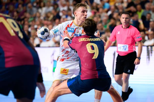 Cologne, Germany Handball EHF CL Final 4 semi-final Barca SC Magdeburg from left in duel Gisli Thorgeir Kristjansson SC Magdeburg , Jonathan Carlsbogard Barcelona Cologne Lanxess Arena Nordrhein Westfalen Germany