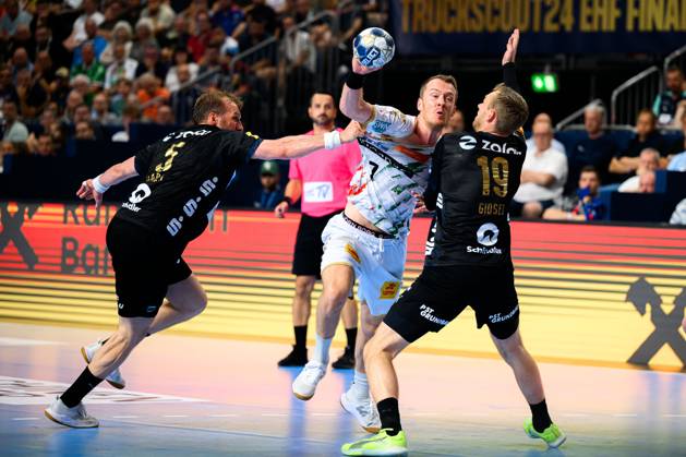 Cologne, Germany Handball EHF CL Final 4 Final Fuechse Berlin SC Magdeburg from left Max Darj Berlin , Felix Claar Magdeburg , Mathias Gidsel Berlin Cologne Lanxess Arena Nordrhein Westfalen Germany