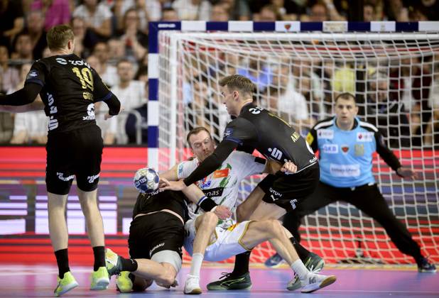from l Mathias GIDSEL B , Mijajlo MARSENIC B , Felix CLAAR MD , Lasse ANDERSSON B , action, duel, Handball Champions League Final Four 2025, Final, Fuechse Berlin B SC Magdeburg MD , on 15 06 2025 in Cologne Germany Â