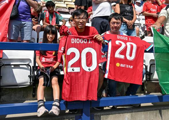 Preston, England, 13th July 2025. Liverpool fans holding shirts in tribute of Liverpool player Diogo Jota ahead of the Preston North End vs Liverpool Pre Season Friendly match at Deepdale, Preston. Picture credit should read: Cody Froggatt Sportimage EDITORIAL USE ONLY. No use with unauthorised audio, video, data, fixture lists, club league logos or live services. Online in-match use limited to 120 images, no video emulation. No use in betting, games or single club league player publications. SPI_014_CF_PRESTON_V_LIVERPOOL SPI-4018-0014