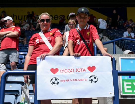 Preston, England, 13th July 2025. Liverpool fans holding a banner in tribute of Liverpool player Diogo Jota ahead of the Preston North End vs Liverpool Pre Season Friendly match at Deepdale, Preston. Picture credit should read: Cody Froggatt Sportimage EDITORIAL USE ONLY. No use with unauthorised audio, video, data, fixture lists, club league logos or live services. Online in-match use limited to 120 images, no video emulation. No use in betting, games or single club league player publications. SPI_015_CF_PRESTON_V_LIVERPOOL SPI-4018-0015